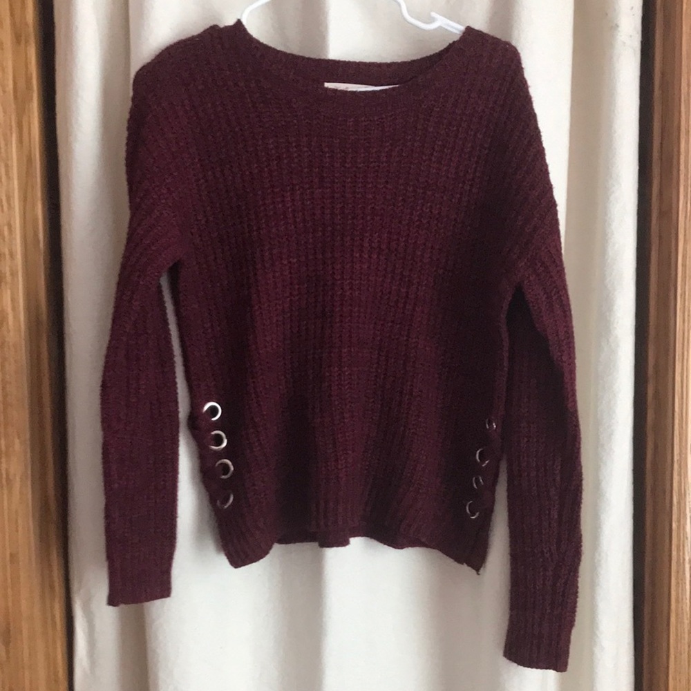 XS purple sweater with details on sides.